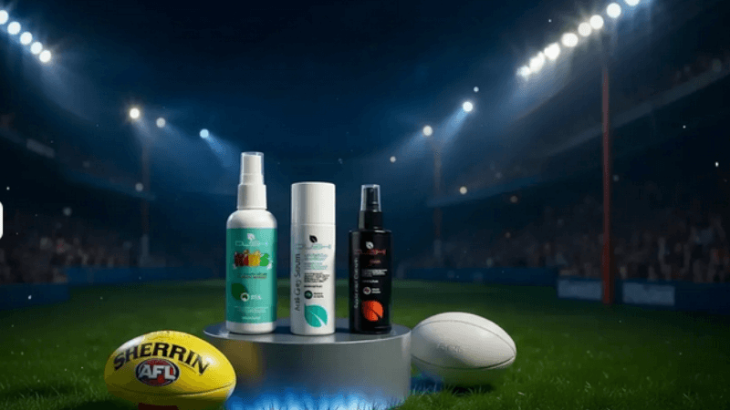 Four Dushi serums on glossy turf at a packed stadium, with goal posts and a generic footy ball. Grand Final Week offer.