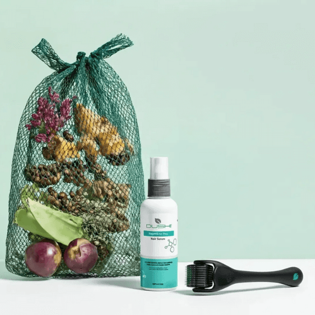 Green mesh bag with natural items, a white dushi bottle, and black brush on a light green background