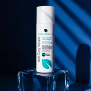 Dush Anti-Grey Serum bottle on a clear block with a blue gradient background