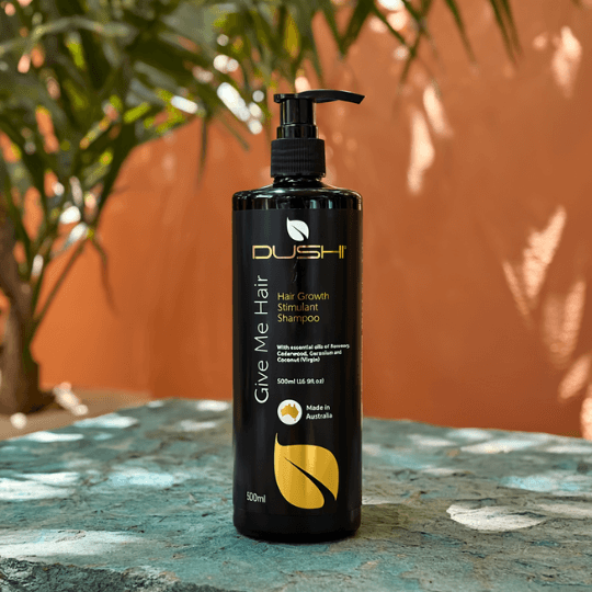 Dushi hair care product on a stone surface with a natural background